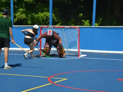 Camper playing hockey